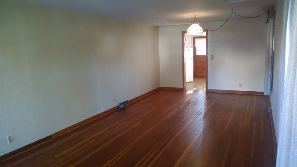 Living room looking into kitchen and back entry - 507 N Division Ave