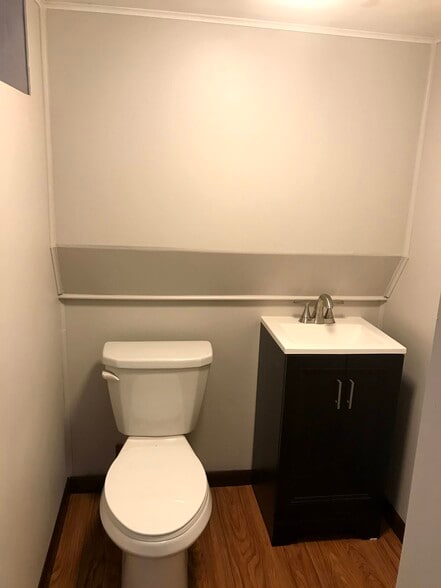 Ground lvl powder room w/ new vanity & toilet - 1262 Onondago St