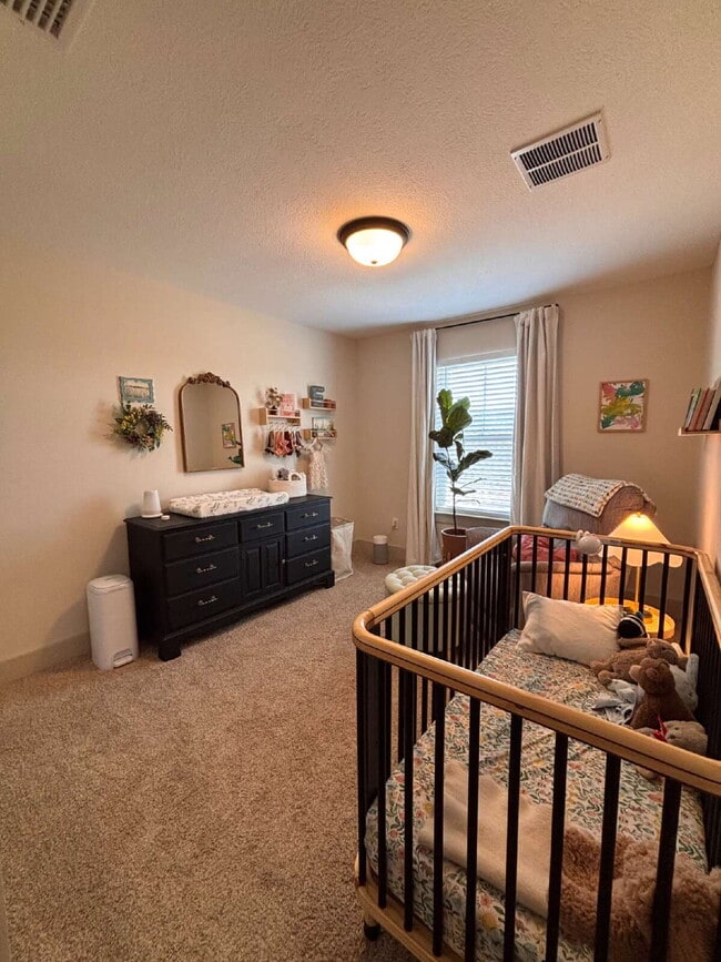 Building Photo - Need Space?  How about 5 bedrooms, 2.5 baths + an extra bonus area upstairs so that the kids can ...