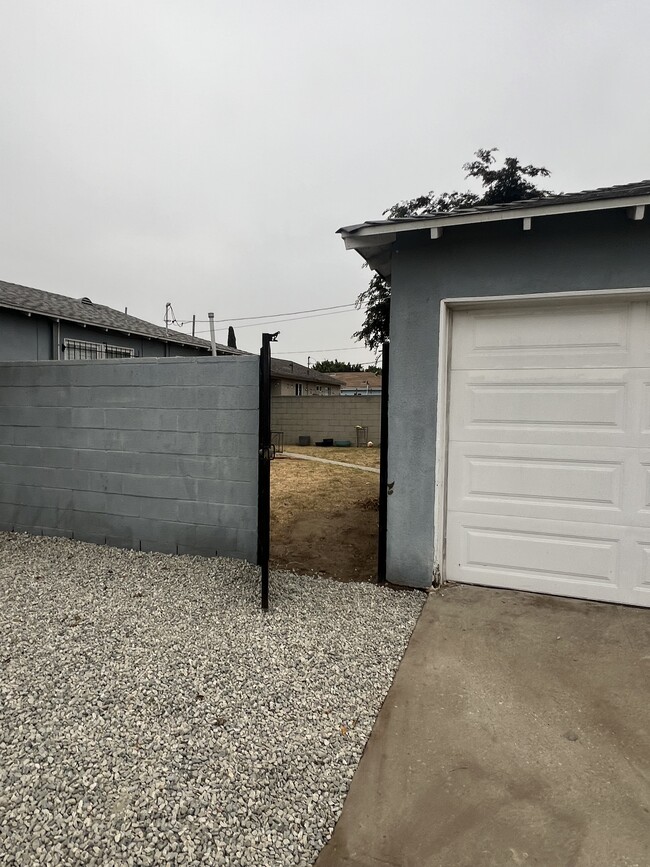 Gated back yard entry - 900 E 118th Pl