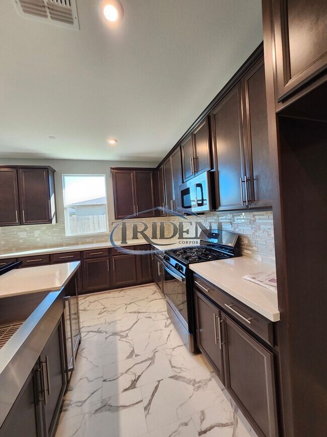 Building Photo - Updated home with a built in BBQ and play area