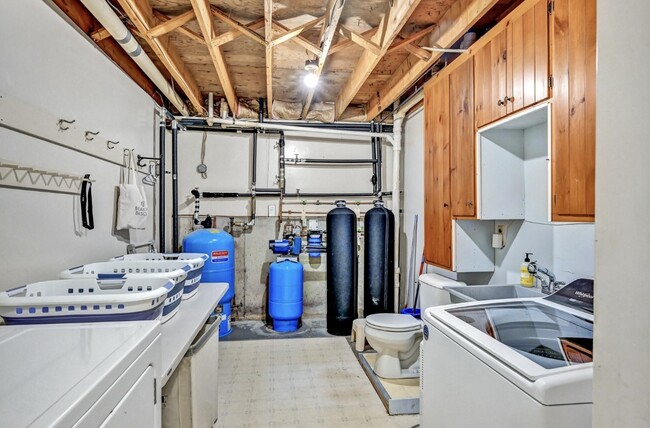 Basement laundry room with water system - 252 Ridge Rd