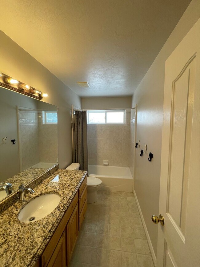 Building Photo - Beautiful home with 3 car garage and oversized covered deck.