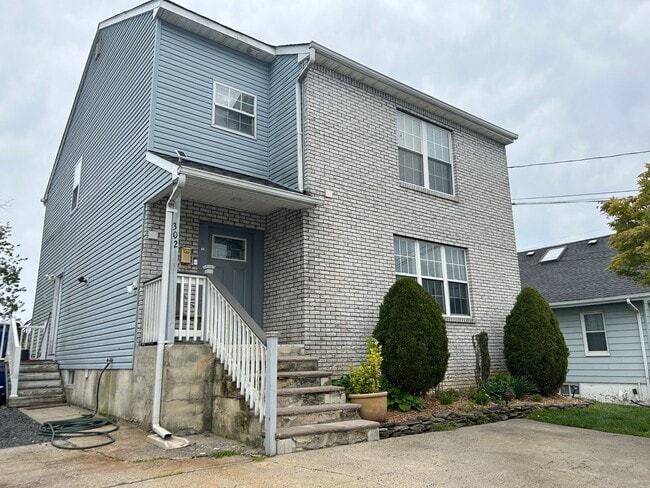 Building Photo - Discover Your Dream Home in Neptune: Spacious 4-Bedroom, 2.5-Bath with Private Backyard and Drive...