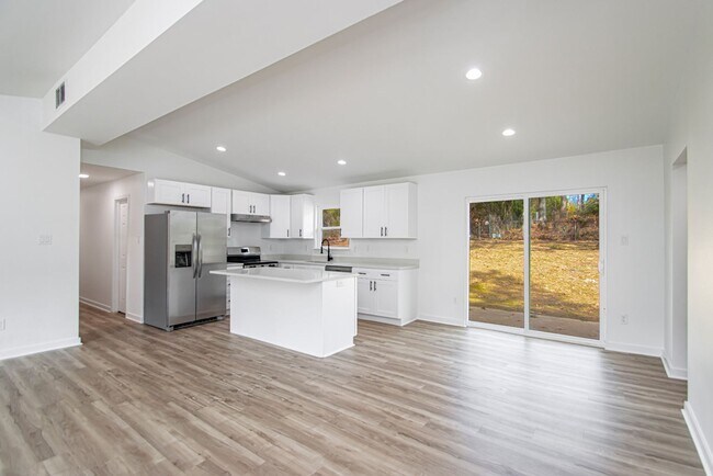 Building Photo - Large Open-Concept 4 Bedroom with Stunning Pond Views!