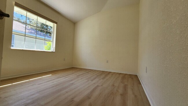 Building Photo - Fresh Paint, New Floors, and a Heated Pool...