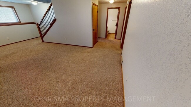 Building Photo - BEAUTIFUL 4 BD, 2 BA TOWNHOME WITH A FULLY EQUIPED KITCHEN, VAULTED CEILINGS, FIREPLACE, ATTACHED...