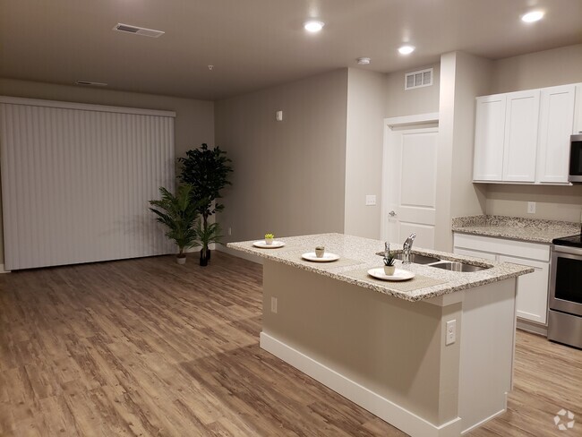 Kitchen opens to living area - 14341 E Tennessee Ave