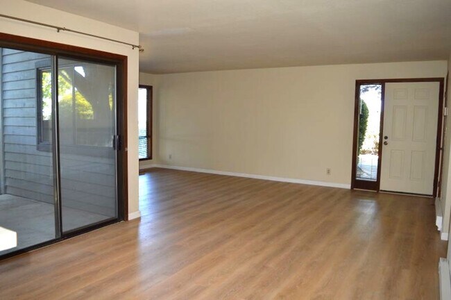 Building Photo - Spacious and Conveniently Located with Private Patio and Parking