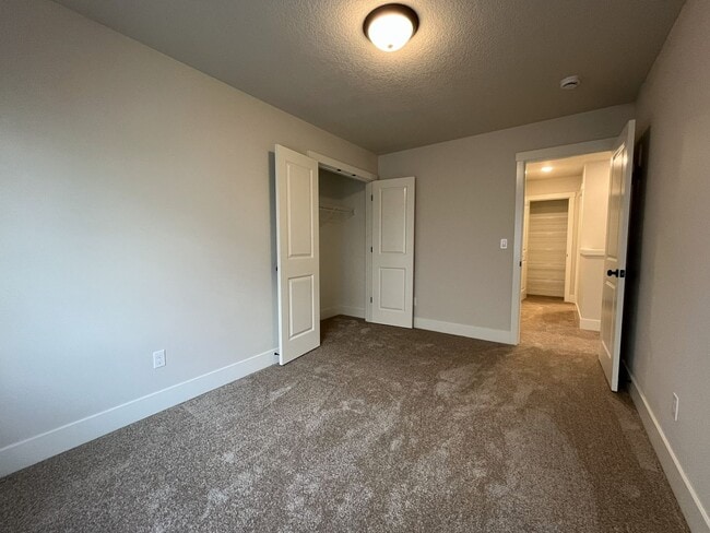 Building Photo - Modern 2025-Built 4 Bedroom Home with EV Charging, 5kW Solar, Open-Concept Living, Scenic Outdoor...