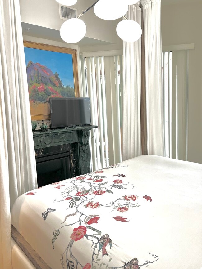 Master Bedroom iwith Electric Fireplace - 388 E Ocean Blvd