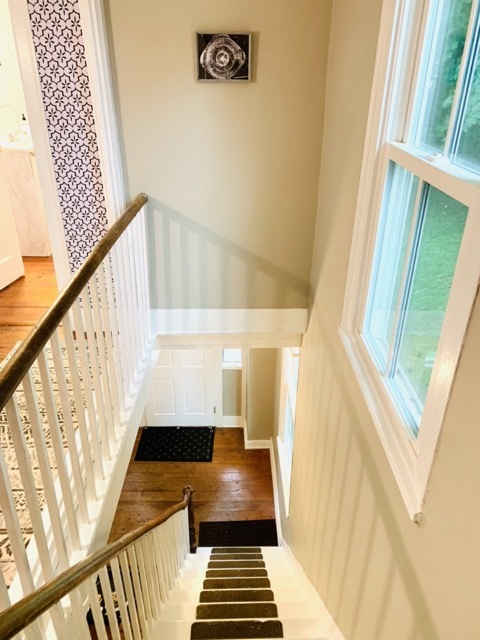 upstairs hallway, stairs down to foyer/front door - 1579 Pleasant St