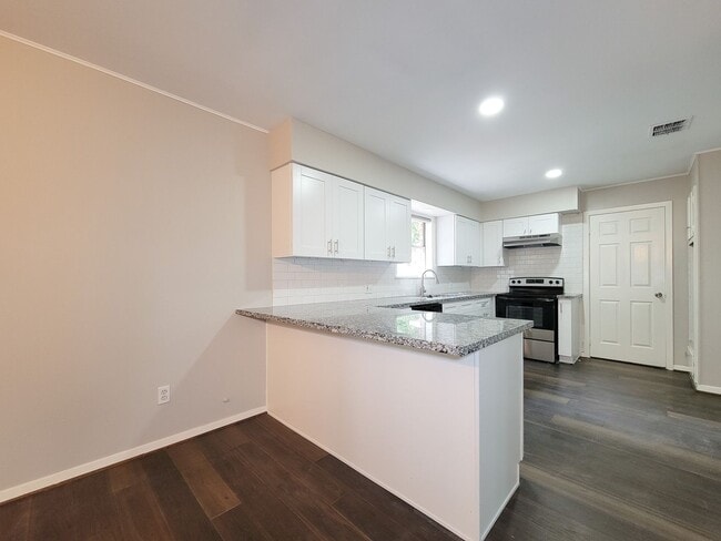 Building Photo - Welcome to your dream rental! This meticulously remodeled 3-bedroom, 2-bathroom home in the heart...