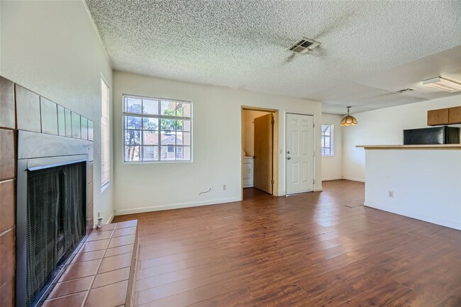 Building Photo - 2nd Story 2-Bed Condo with Tile Fireplace
