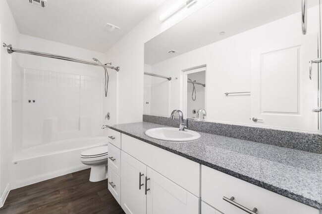 Building Photo - Modern Mosaic Townhome with Stylish Finishes & Resort-Style Community Amenities!