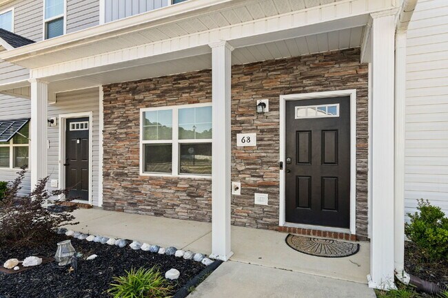 Building Photo - Available Now! Enjoy low-maintenance coastal living in this beautiful 2-bedroom, 2.5-bath townhom...