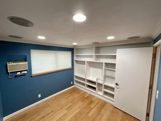 Office with bookshelves and AC unit - 49 Bayo Vista Way