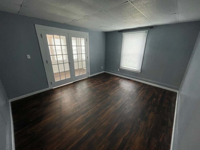 Better view from the entrance into the family room - distinctive laminate flooring and fresh paint - 6 Catawba Ave