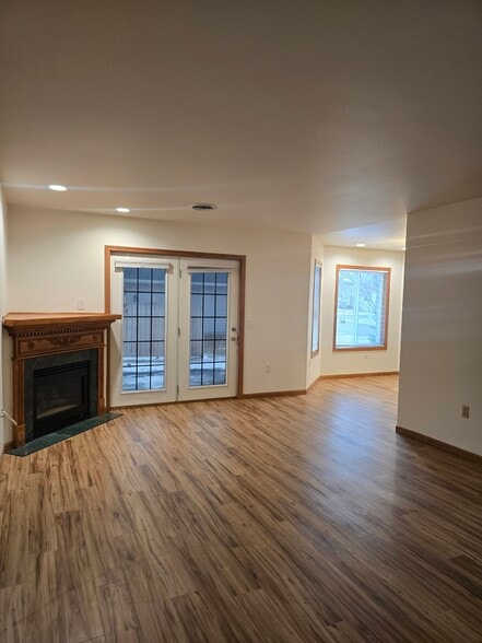 Gas fireplace and patio doors that lead to a private patio. - 1640 Terrill St