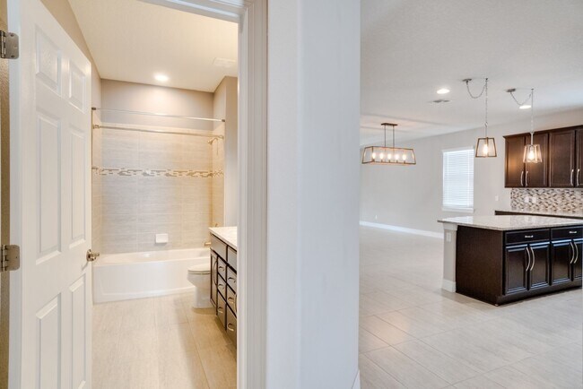 Building Photo - Stunning 3-Bedroom Pool Home with Bonus Room in the Gated Community of Lakeshore at Narcoossee