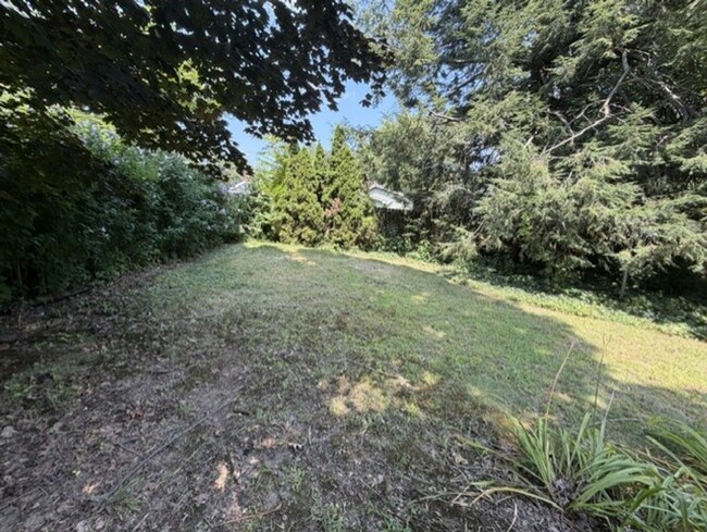 Building Photo - Three Levels of Living with 4 Bedrooms, 2 Full Bathrooms and Multiple Living Areas!