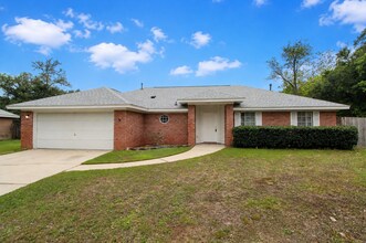 Building Photo - West Pensacola Brick Home with Vaulted Ceilings, Split Floor Plan, Open Living Design & Easy Acce...
