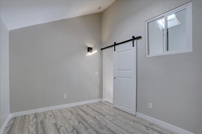 Building Photo - Stunning Top-Floor End Unit with Vaulted Ceilings and Modern Finishes