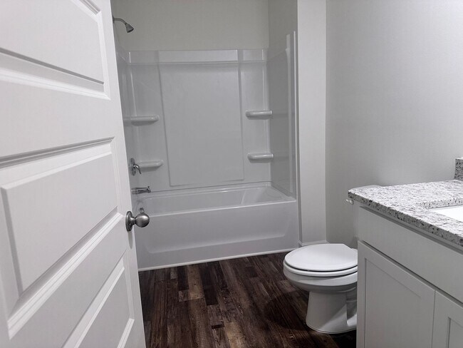 Building Photo - efficient two-level home provides a large living room, 4 very spacious bedrooms, and 2.5 bathrooms