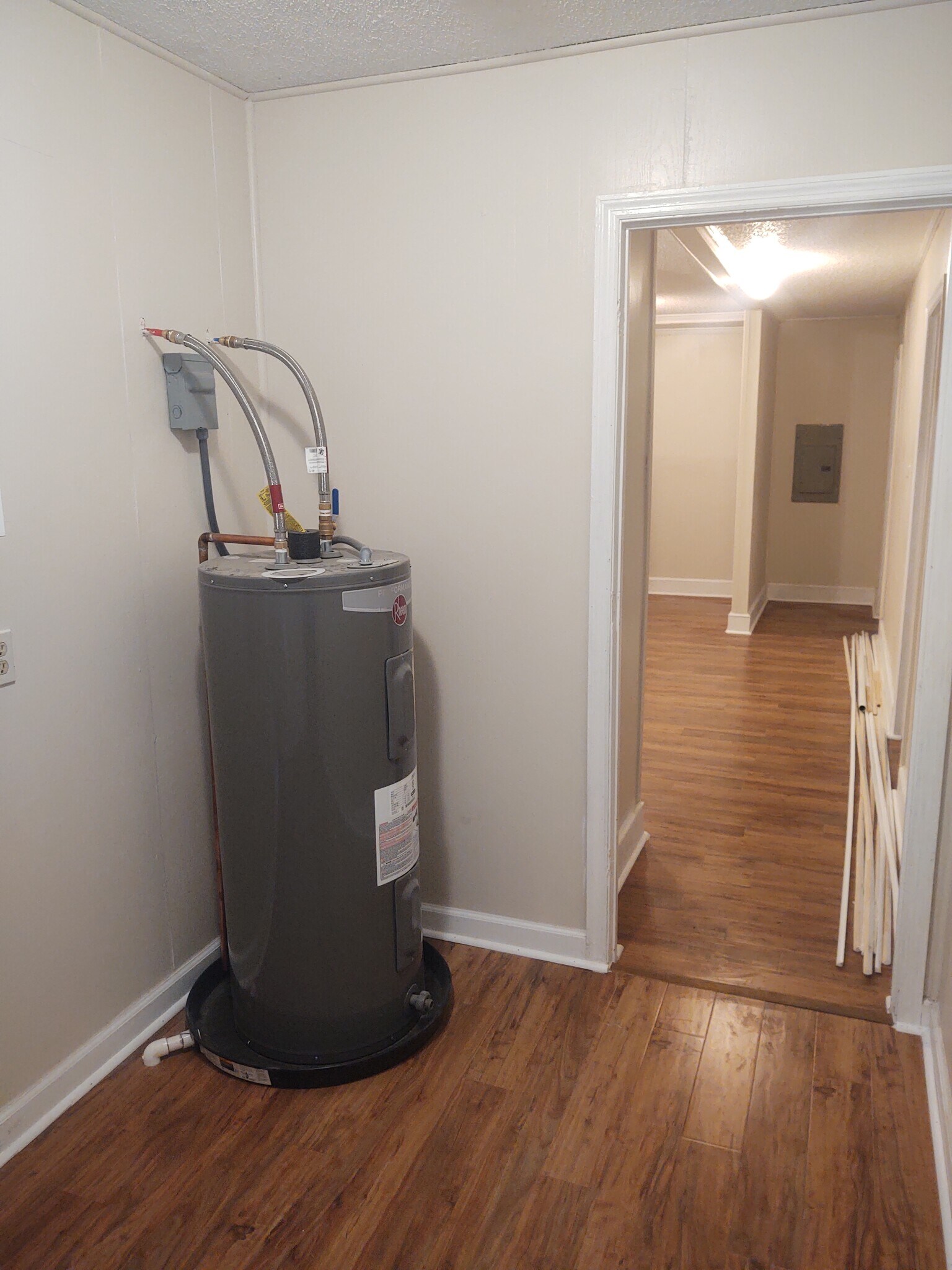 Laundry room, two back bedrooms on right, second bathroom to right of electrical panel - 116 Houseworth St