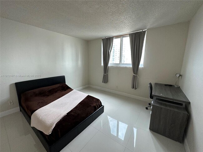 Building Photo - 19380 Collins Ave