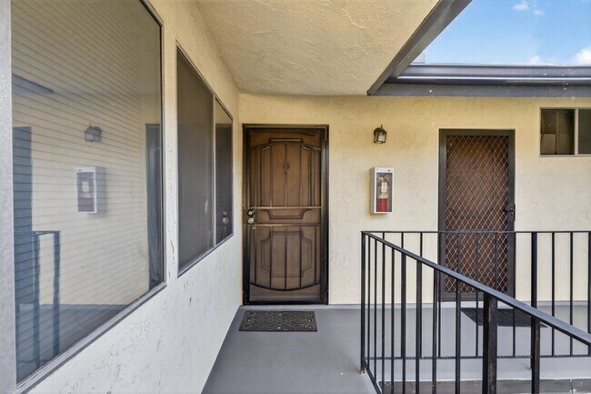 Building Photo - Gorgeous 2 Bedroom inside Gated Community! Close to Beach