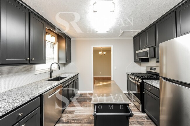 Building Photo - This lovely home is ready for your personal touch!