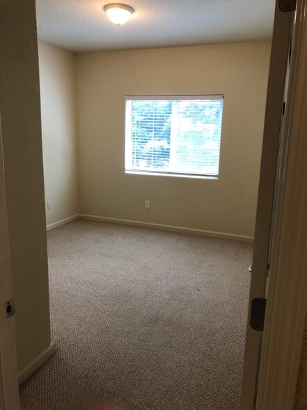 Bedroom #2 to the right of hallway across from bathroom - 10001 Woodcreek Oaks Blvd