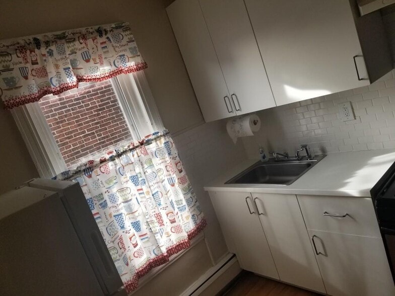 Kitchen with fridge, stove and microwave. - 3534 N 8th St
