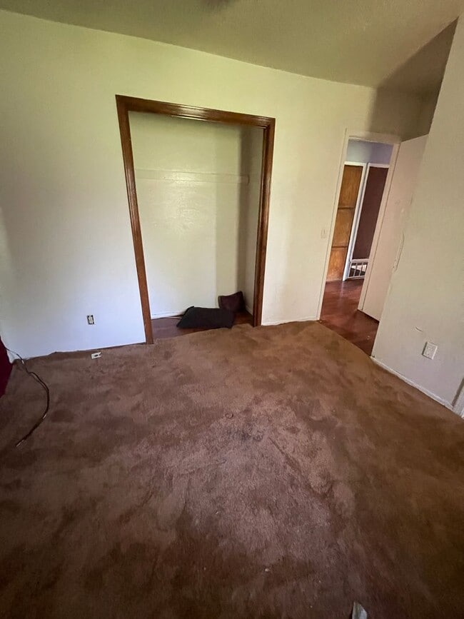 Building Photo - 3BD Home needing some TLC!! Has Fenced in Backyard & a 2-Car Garage!!