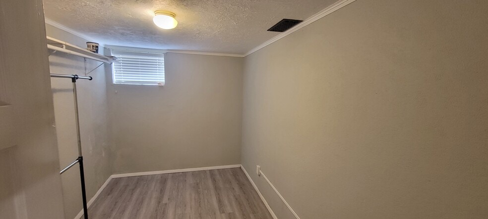 Looking closer inside the lower level walk-in closet. - 814 Atchison Ave