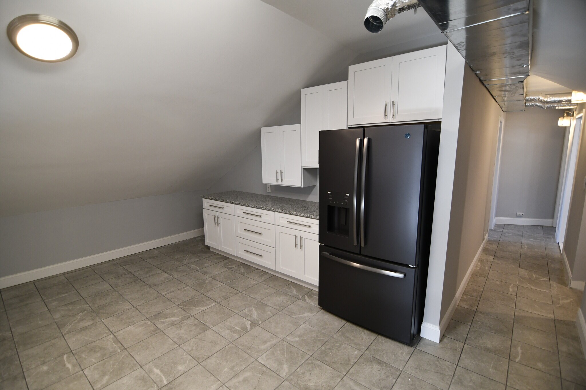 New Refrigerator, cabinets, counter top, and tile floor. - 309 Old York Rd