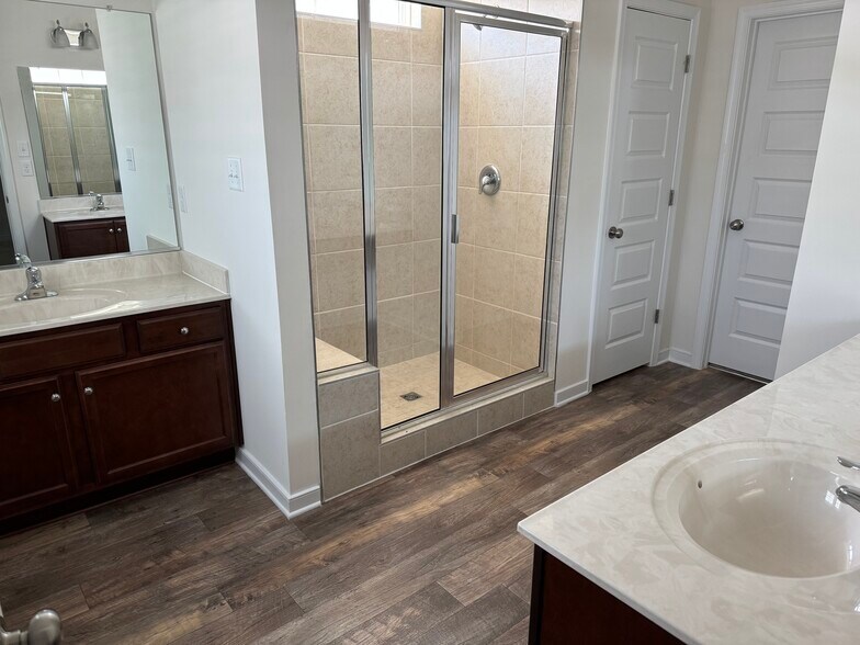 Spacious primary bathroom with two sinks, large vanity, separate toilet room and walk-in closet - 7820 Vermeil St