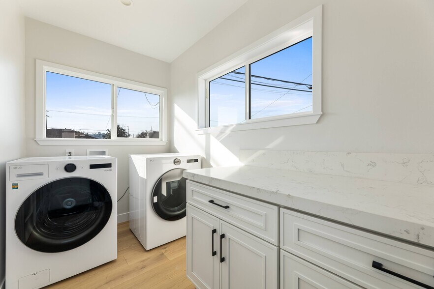 In unit, new washer and dryer in dedicated laundry room space inside the house. - 1823 N Ditman Ave