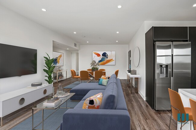 Open-Concept Kitchen, Dining, and Living Room with Vialy Flooring and Recessed Lighting - Selby Venti by Wiseman