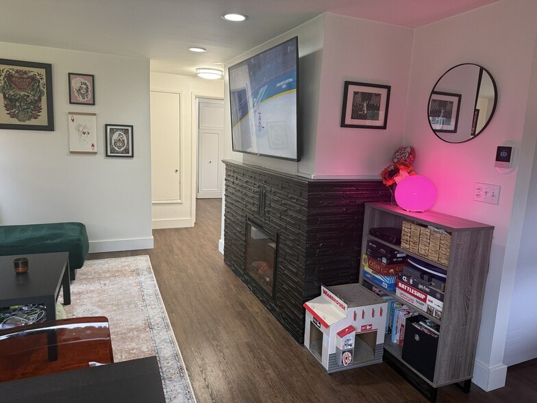 Living room with electric fireplace - 814 N 105th St