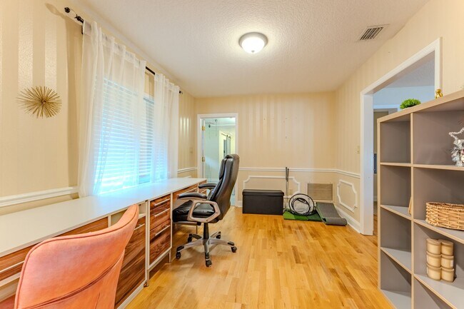 Building Photo - Lake Jessamine Luxury: Solar-Powered Waterfront Retreat on 1.14 Acres with Dock & Boathouse