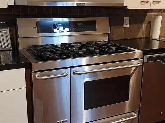 Building Photo - "Spacious 5-Bedroom Retreat with Fireplace Charm on S Broadway!"