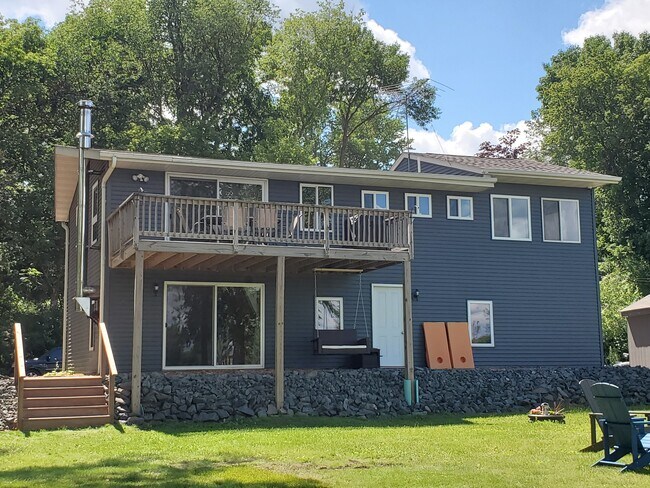 Back of house from lake. Stairs down to back yard. - 18629 Langly Ave N