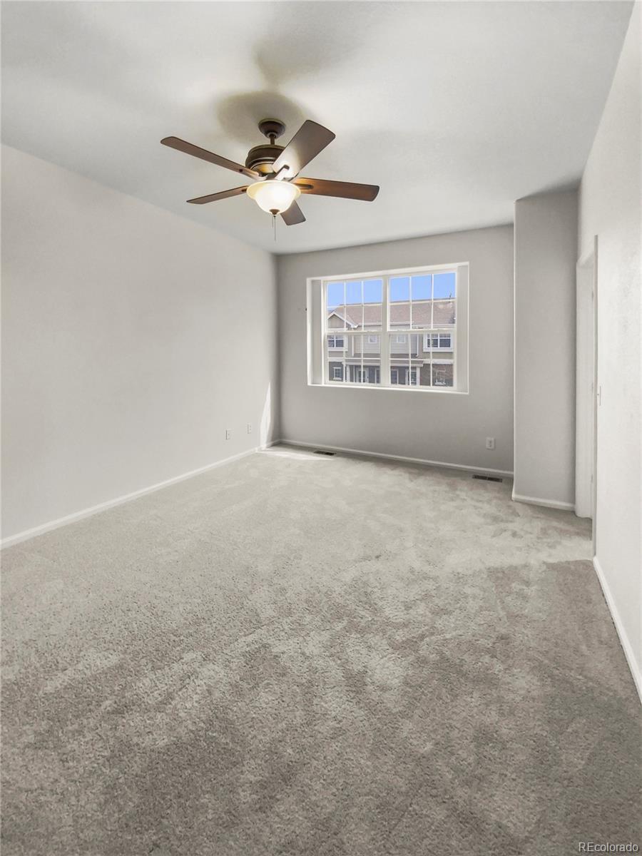 primary bedroom w/ walk-in closet - 14700 E 104th Ave