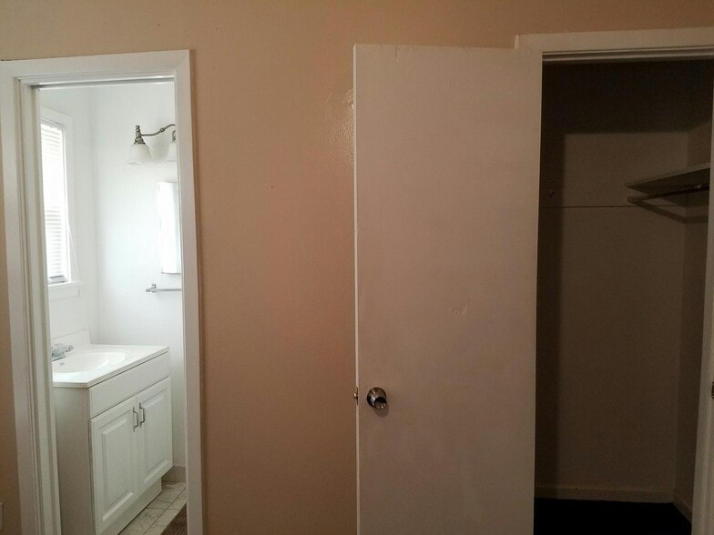 Master bedroom has an updated half bath. - 4024 Forbes Street
