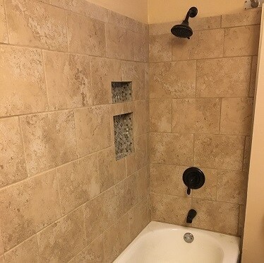 Shower/bath combo retiled with new fixtures in 2019 - 3452 Nicollet Ave