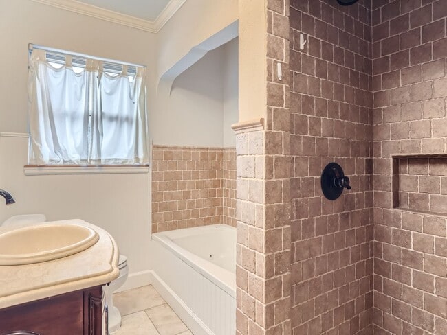 Building Photo - Evolve Real Estate: Available 8/8/26 Brick Tudor with Large Yard and Finished Basement!