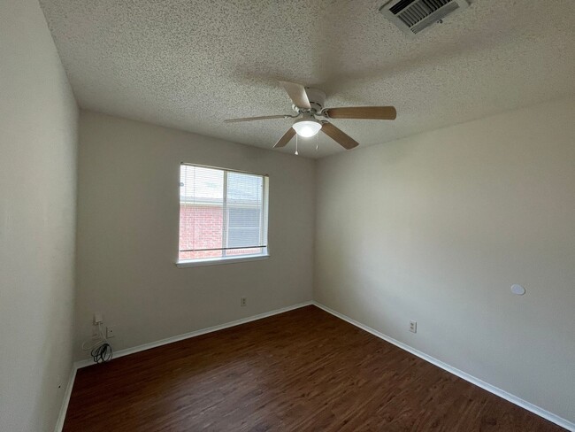 Building Photo - SPACIOUS HOME - NEW FLOORING! - 2 LIVING A...