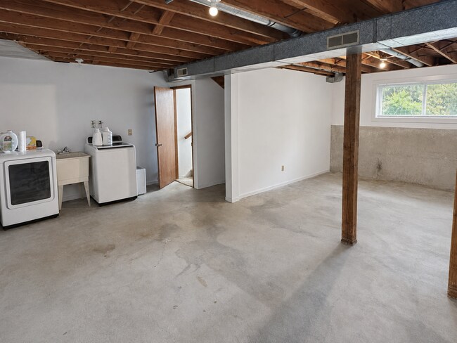 Building Photo - Beautiful Split-Level Home with Fireplace, Deck, Garage, and EV Charger